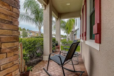 Covered front porch with brick pavers