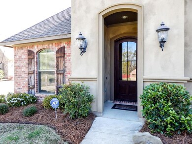 Front entry with glass front door and lovely lands