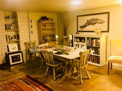Dining area with built-in book shelves, table, cha