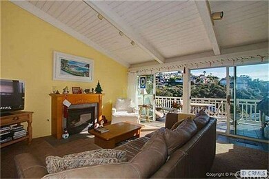 Electric faux fireplace and hillside views.