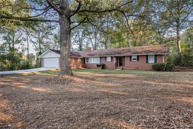 Ranch-style home featuring a garage