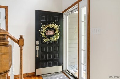 Beautiful front entry door leading you inside wher