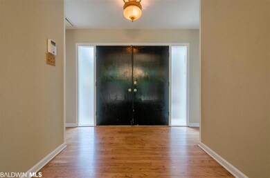 Double doors w/ sidelights leading to the foyer.