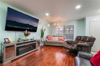 Living area featuring wood finished floors, recess