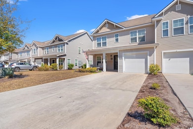 Multi unit property featuring a garage, a resident