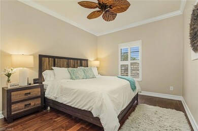 Bedroom featuring dark wood-type flooring, ceiling