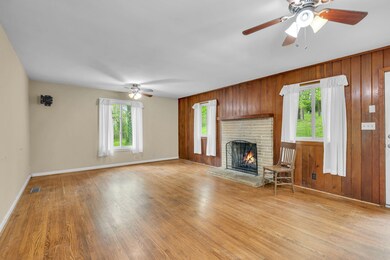 Large Living Room accented with beautiful wood paneling!