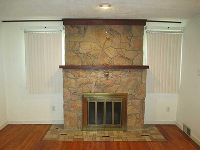 Living Room. Stone wood burning fireplace in LR