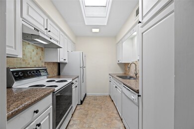 Now into the galley kitchen. Features include gran