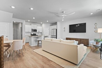 Living area featuring visible vents, recessed ligh