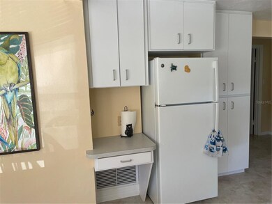 Amongst the cabinets is a pantry and desk area.