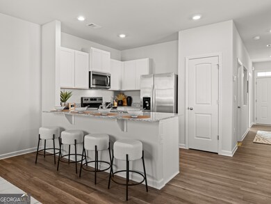 Pearson kitchen open to the living area with white
