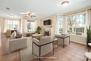Living area featuring a fireplace, tile patterned