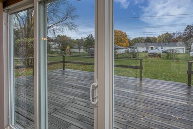 Oversized, expansive patio door leading to deck an