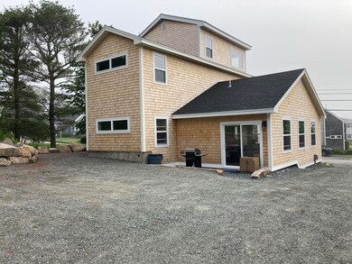 Back view of house & kit. entry.
