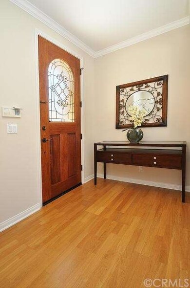 Leaded glass front door is a warm welcome to guest
