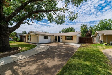 Ranch-style home featuring a front lawn
