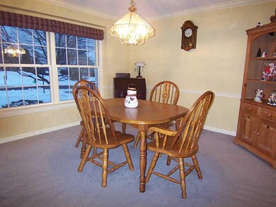 Dining Room. Chair rail and crown molding enhance 