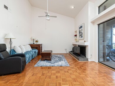 Living area featuring visible vents, baseboards, 