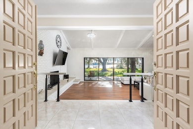 Foyer entrance with light tile patterned floors