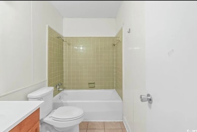 Full bathroom with vanity, shower / tub combination, and tile patterned floors