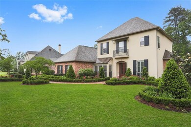 Exterior Front, extensive landscaping, brick walkw