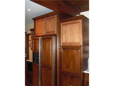 Kitchen. There is a large pantry and matching refr