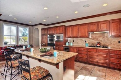Custom Kitchen with Island for Prep and Barstool E