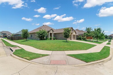 View of front of property featuring a garage and a