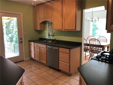 Kitchen leads to Dining Room and private, covered 