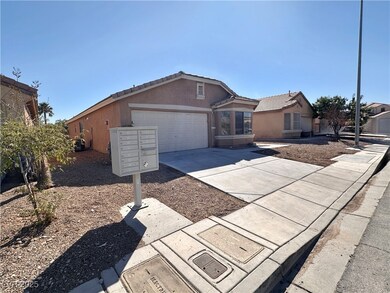 Ranch-style home with concrete driveway, an attach