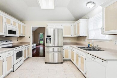 Kitchen has tile flooring, pantry and room for isl