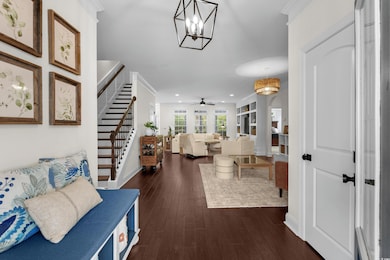 Foyer with recessed lighting, dark wood-type floor