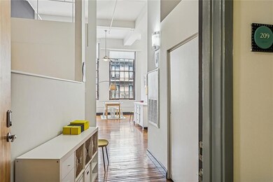 Step inside this GORGEOUS, light-filled Unit 209! The closed doors in the entry are the LAUNDRY with washer/dryer inside the unit.