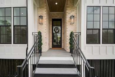 Welcome guests into this inviting home through a c