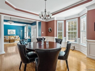 hardwoods, open floor plan to family room and formal dining room