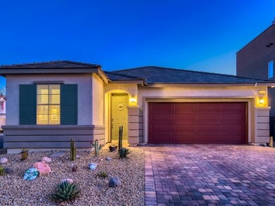FRONT OF HOME WITH FULLY LANDSCAPED EASY MAINTENAN
