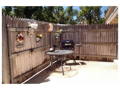 Side yard patio with convenient access to the kitc