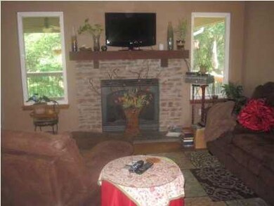 Gas fireplace and large windows overlook the back 