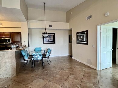 Dining room with baseboards, visible vents, a high