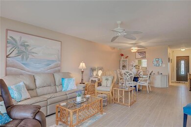 Living area featuring a ceiling fan and light wood-style floors