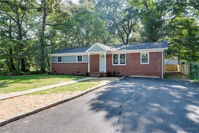 Ranch-style house featuring a front yard