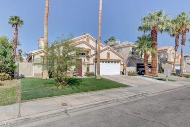 View of front of home with an attached garage, dri