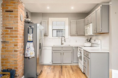 Kitchen features new wood floors