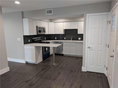 Kitchen with stainless steel appliances, visible 