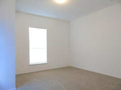Empty room featuring carpet flooring