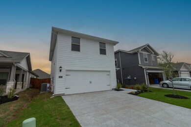 Traditional-style house with an attached garage, c