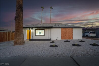 View of front of property featuring fence and stuc