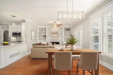 Fireside Family Room, where a Marble Fireplace is flanked by Custom Built-Ins, and the Casual Breakfast Nook offers the perfect spot for morning coffee or family meals.