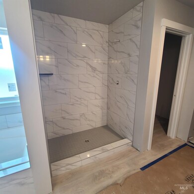 Full bath with a tile shower